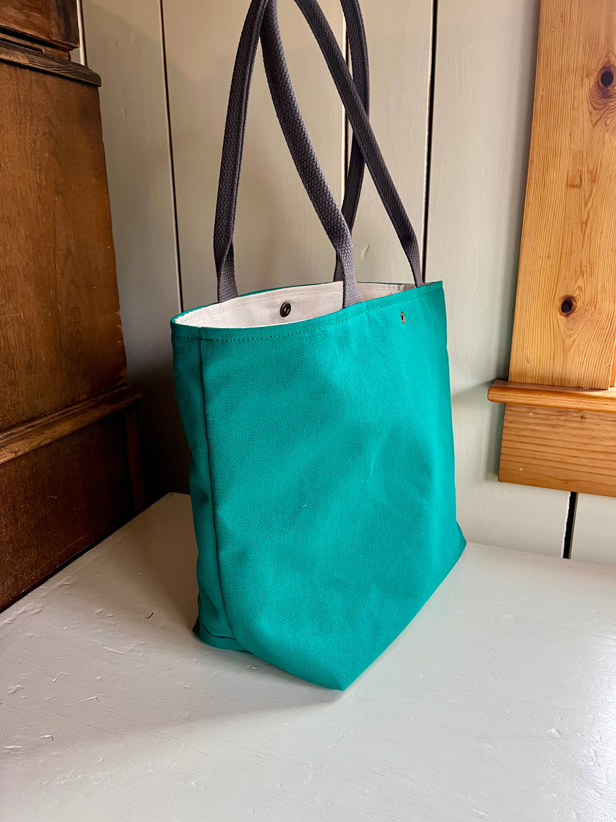 Bent Snap Tote 135 - blue green textile / teal canvas
